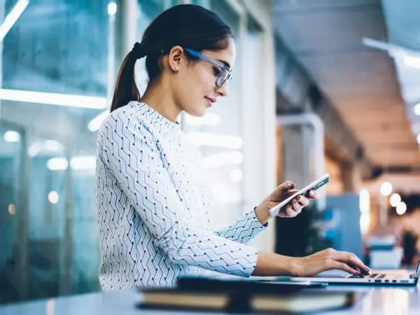 Woman On Phone And Laptop